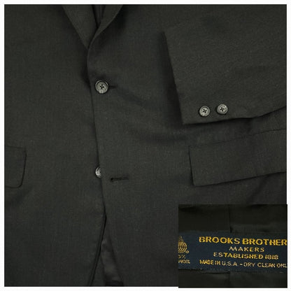 Close up of Brooks Brothers Makers sack jacket showing flap pocket and button detail