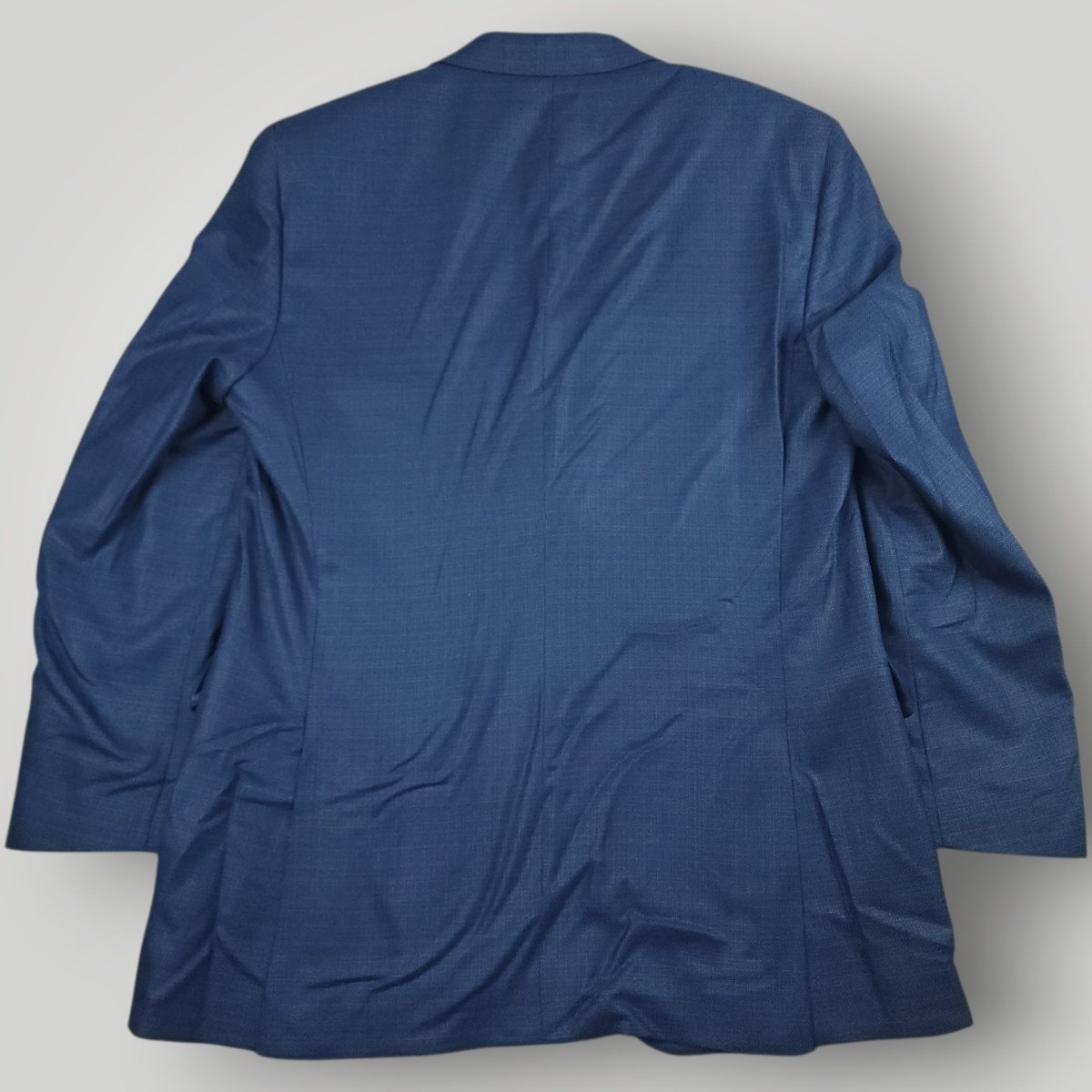 Rear view of Coppley blue hopsack sport coat showing classic tailoring and long length silhouette.