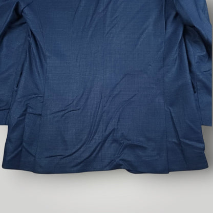 Rear lower view of blue Italian wool sport coat showing vent and hem detail.