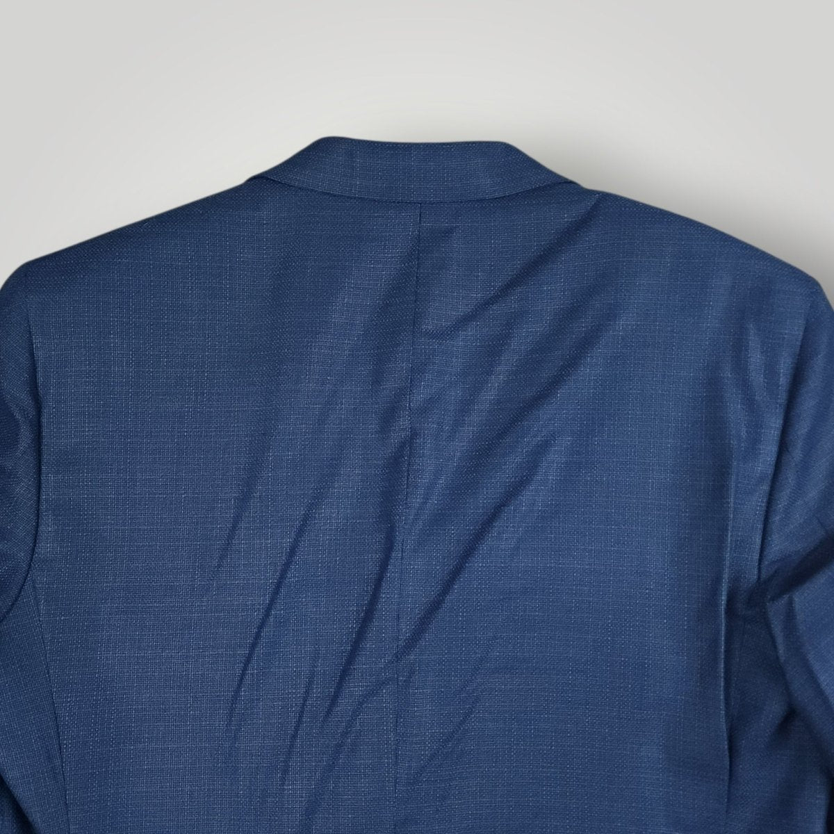 Rear upper view of Coppley sport coat showing shoulder and back construction.