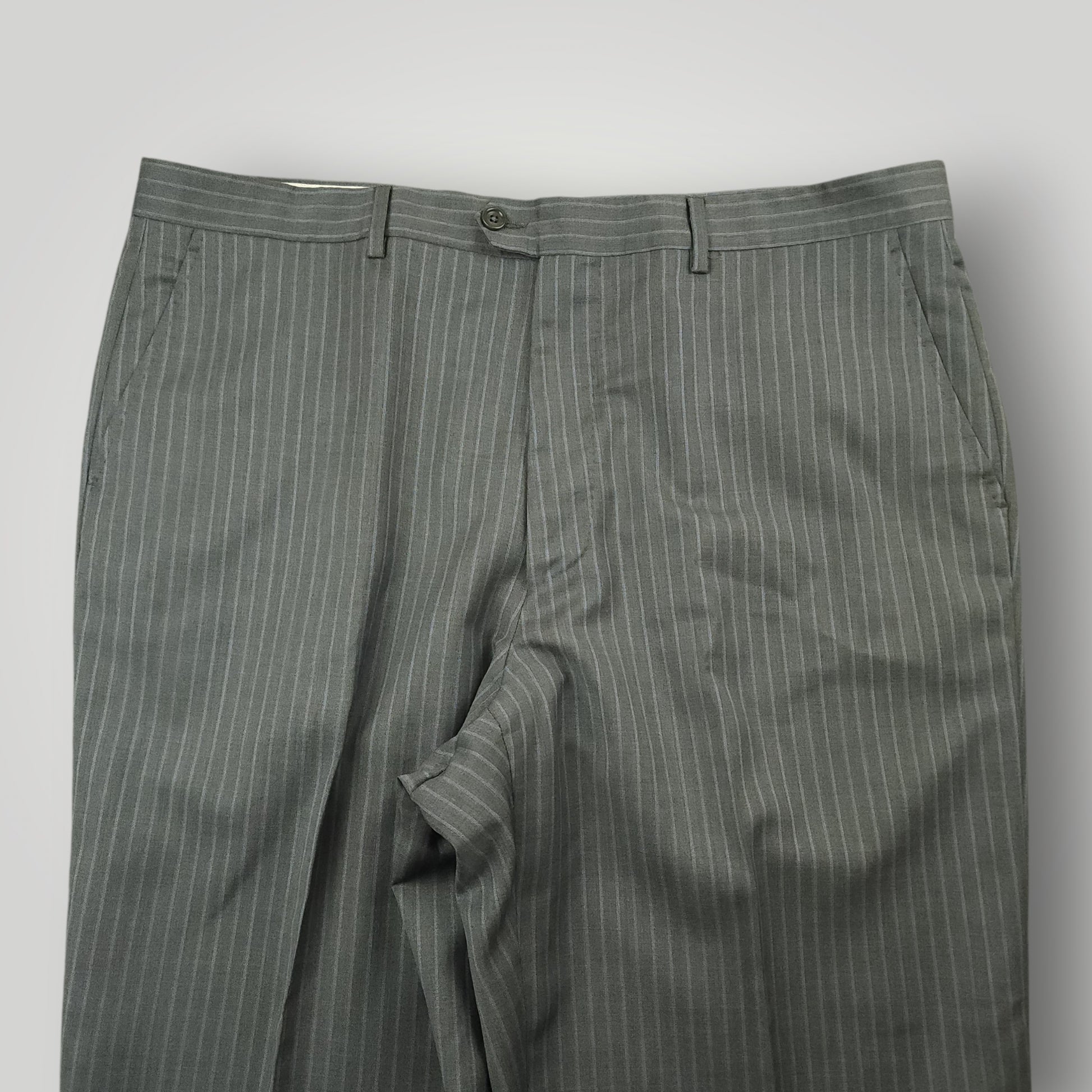 Front detail of gray pinstripe suit trousers