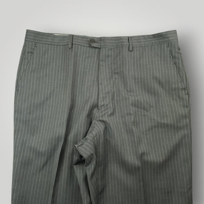 Front detail of gray pinstripe suit trousers