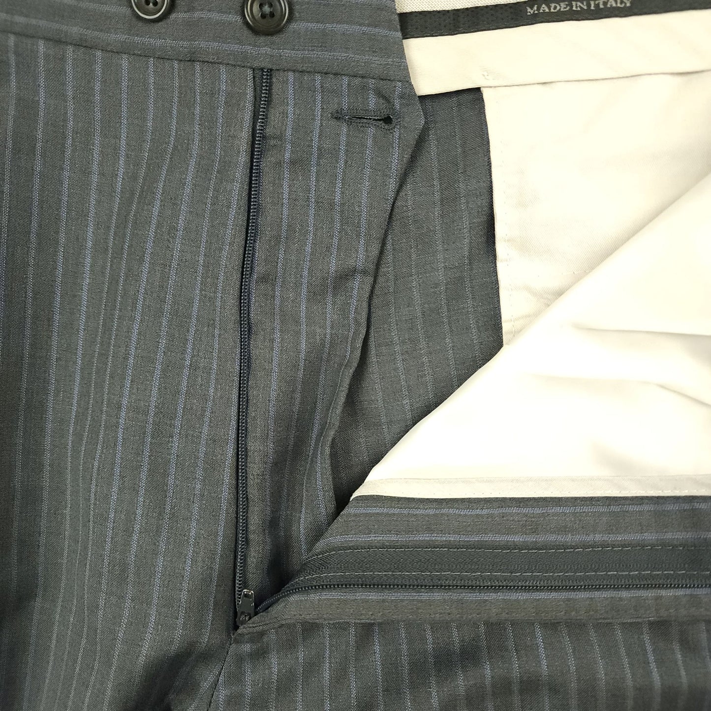 Gray pinstripe wool silk fabric detail on suit jacket and trousers