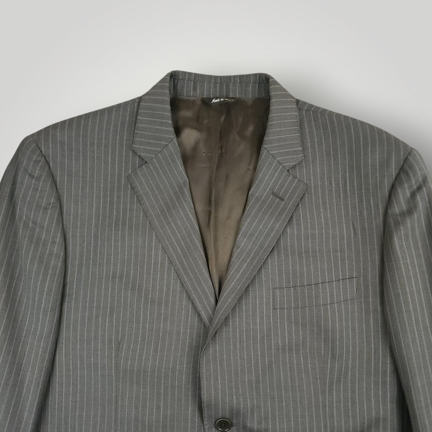 Front jacket detail showing lapel and pinstripe pattern