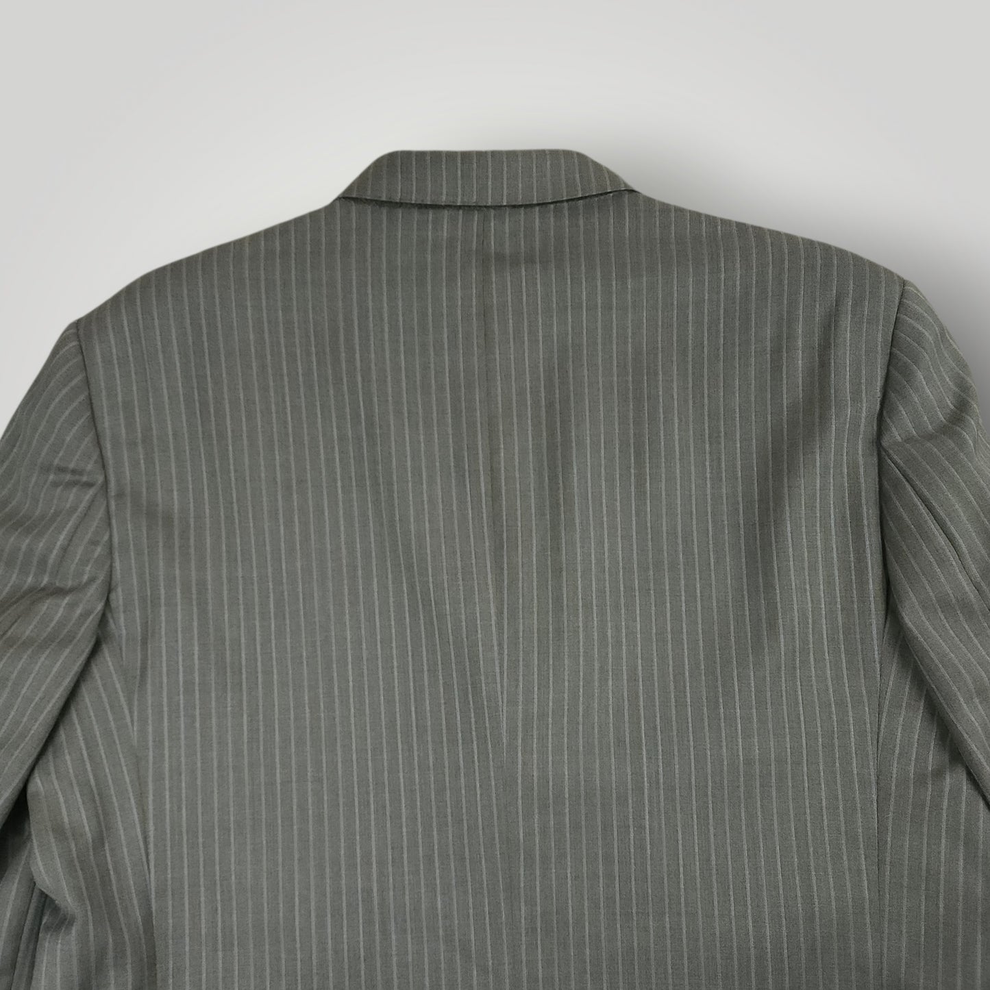 Rear jacket shoulder detail showing gray pinstripe pattern and tailoring