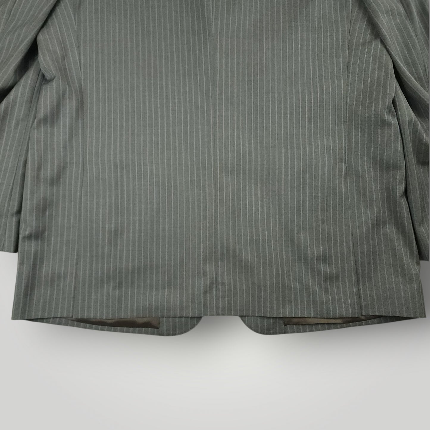 Rear lower jacket detail showing gray pinstripe pattern and tailoring