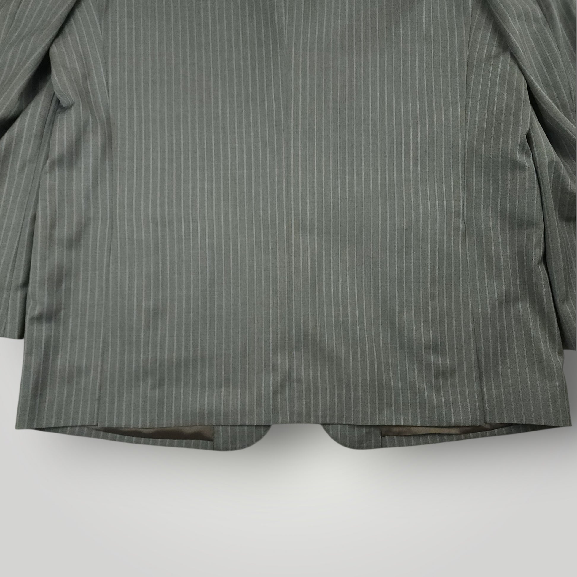 Rear lower jacket detail showing gray pinstripe pattern and tailoring