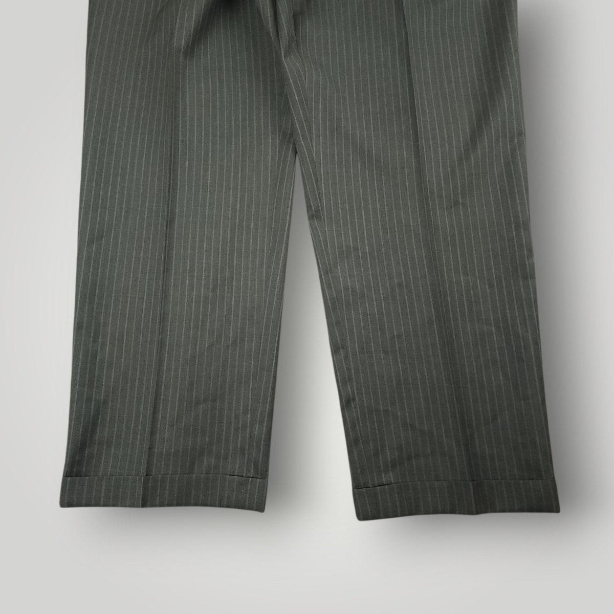 Full length view of matching gray pinstripe suit trousers