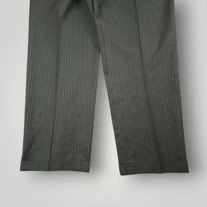 Full length view of matching gray pinstripe suit trousers