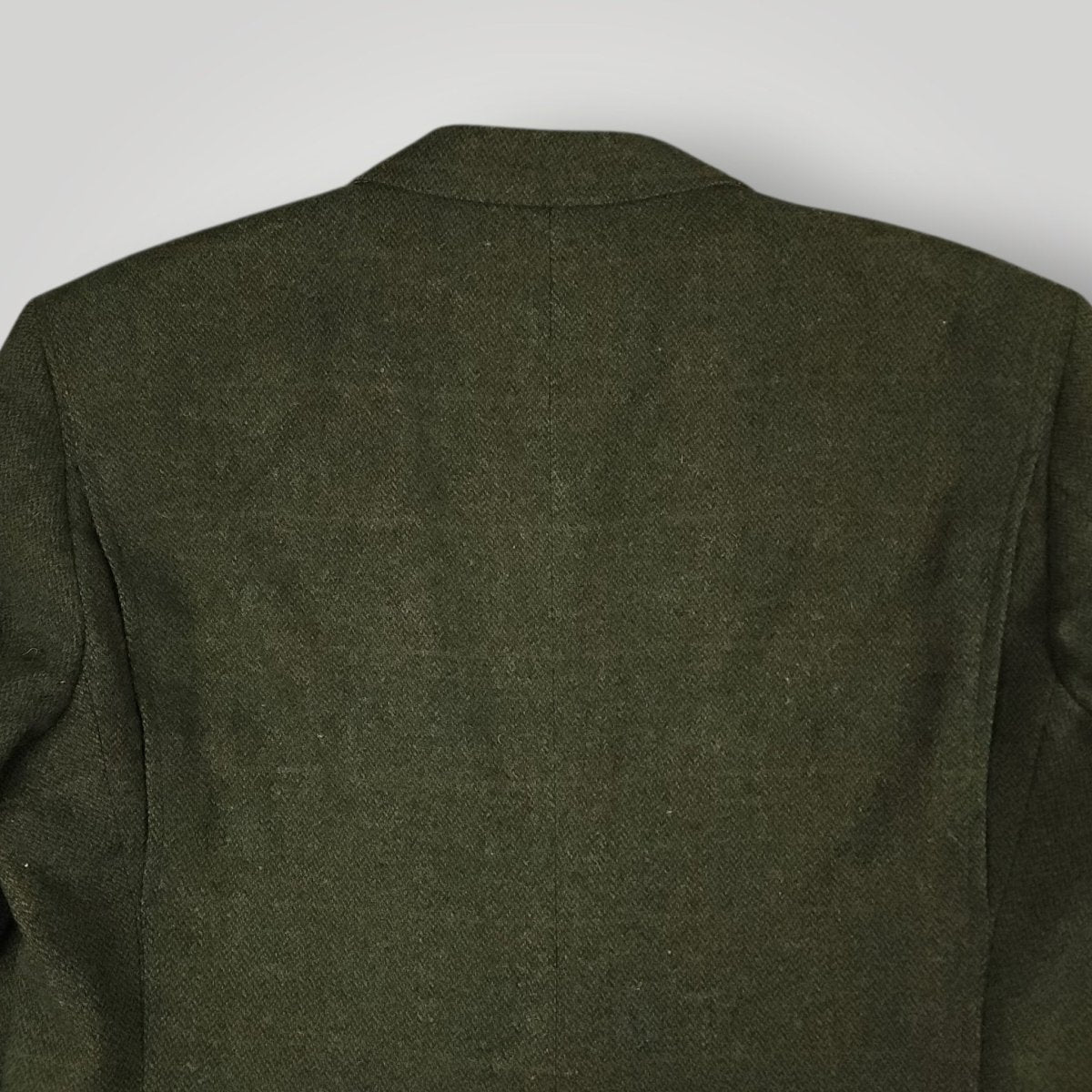 Rear shoulder detail showing olive tweed texture and weave pattern