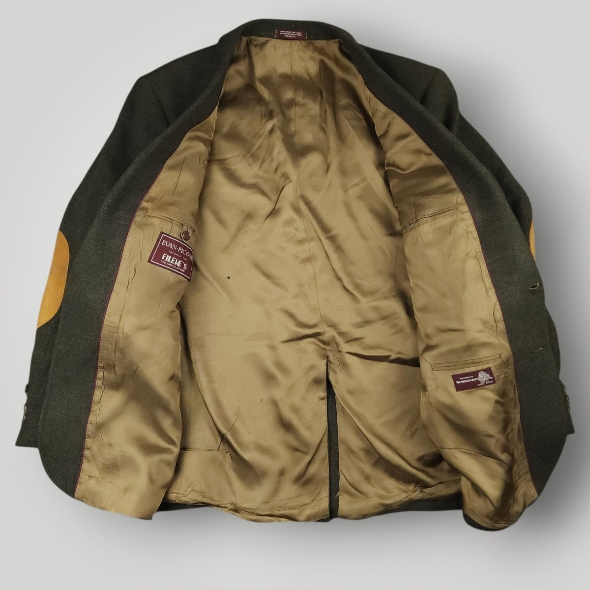 Interior view of vintage olive sport coat showing lining and construction details