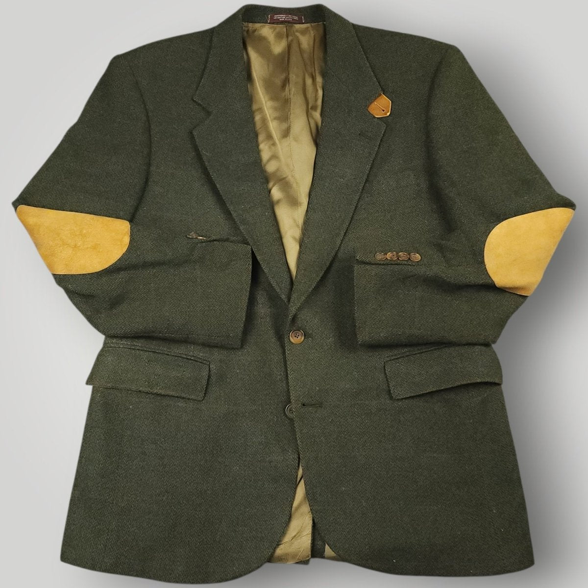 Vintage olive country tweed sport coat with suede elbow patches and classic sporting style