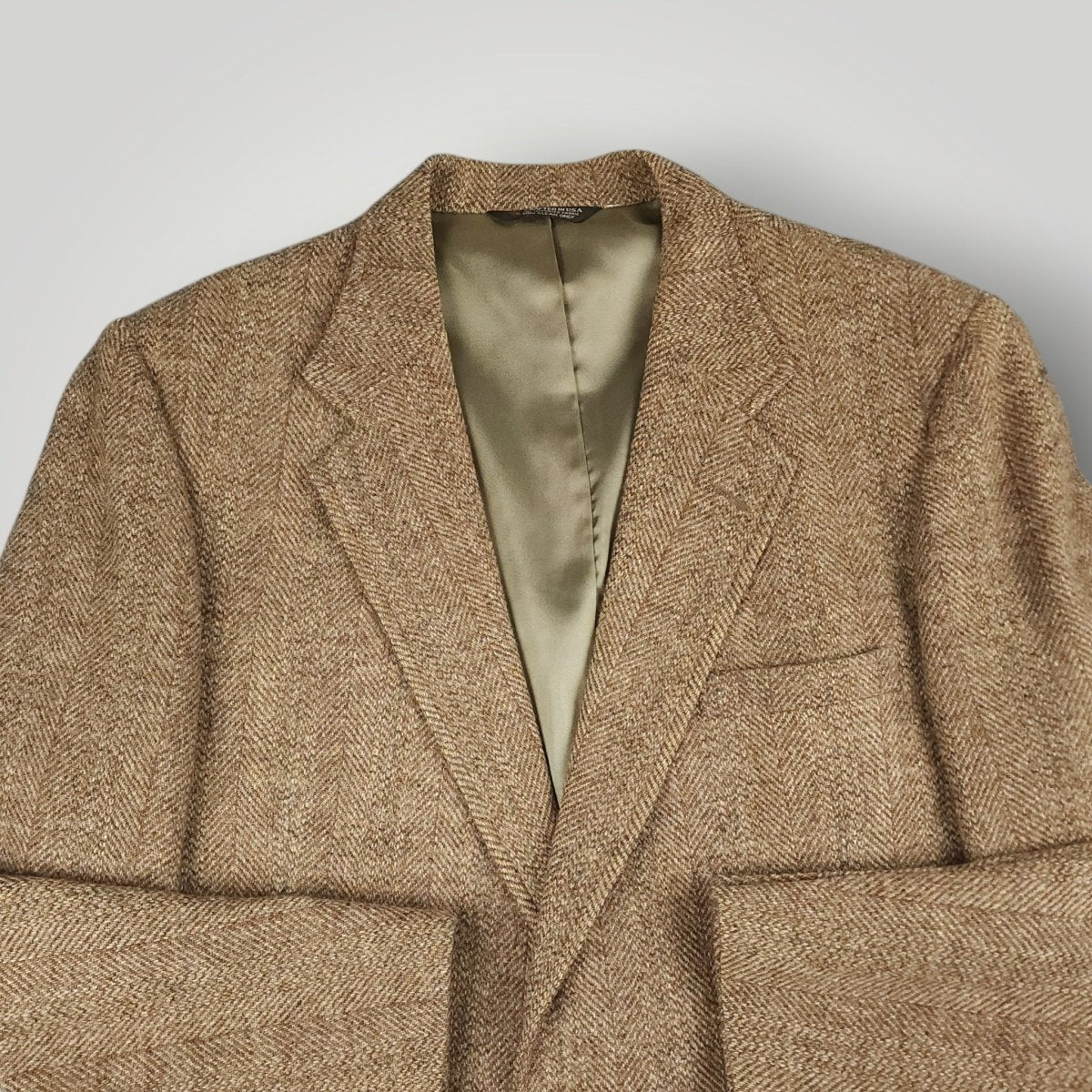 Front angle view of brown herringbone Harris Tweed sport coat