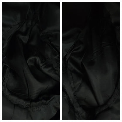 Close-up of the black satin lining inside a gray herringbone tweed jacket