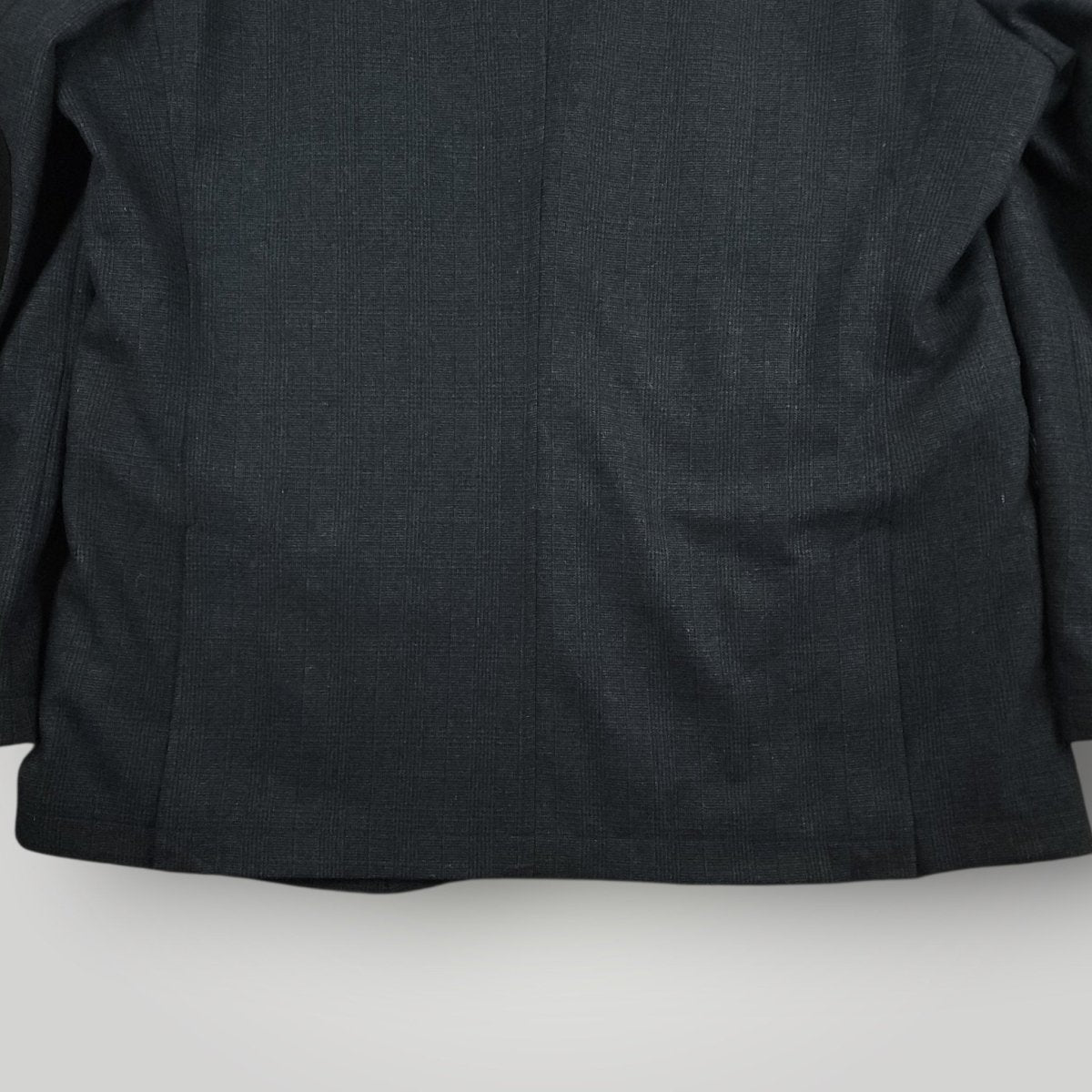Lower back detail of Joseph Abboud hacking jacket showing rear vent and hem