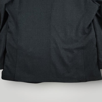 Lower back detail of Joseph Abboud hacking jacket showing rear vent and hem