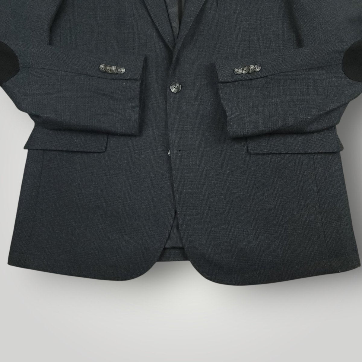 Lower front detail of Joseph Abboud hacking jacket showing flap pockets