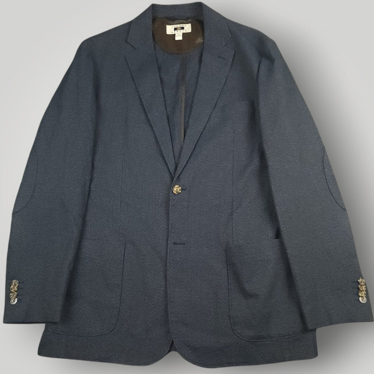 Open front view of Joseph Abboud blue unstructured sport coat showing casual soft tailoring
