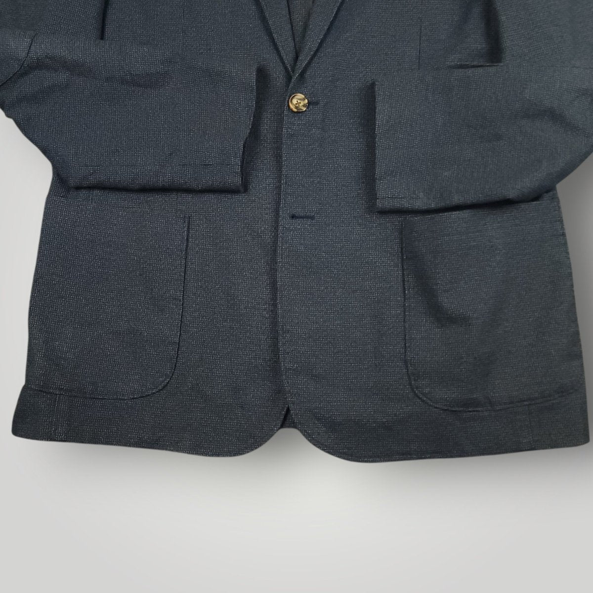 Lower front detail of Joseph Abboud blue sport coat showing patch pockets