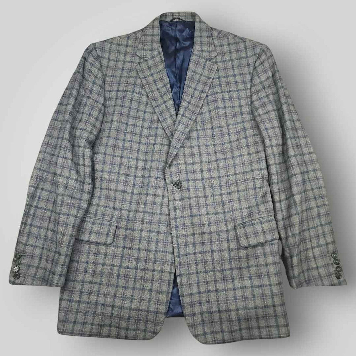 Front view of Tom James Innocenti plaid wool sport coat featuring notched lapels and tailored silhouette.
