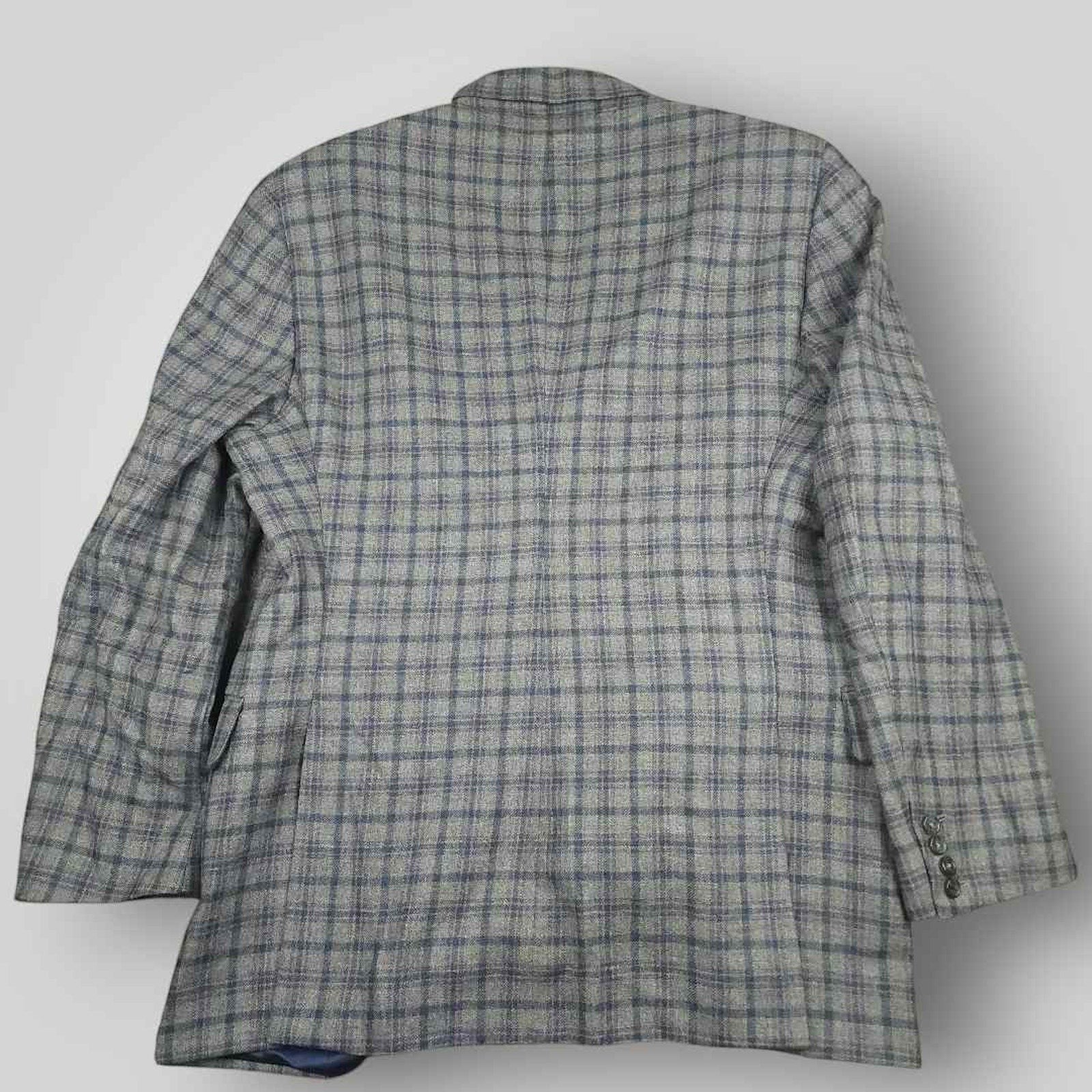 Rear view of Tom James Innocenti Italian wool plaid sport coat showing classic tailored construction.
