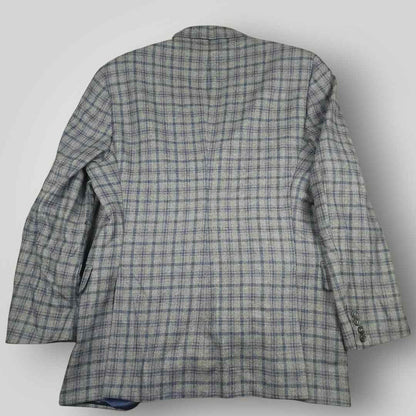 Rear view of Tom James Innocenti Italian wool plaid sport coat showing classic tailored construction.
