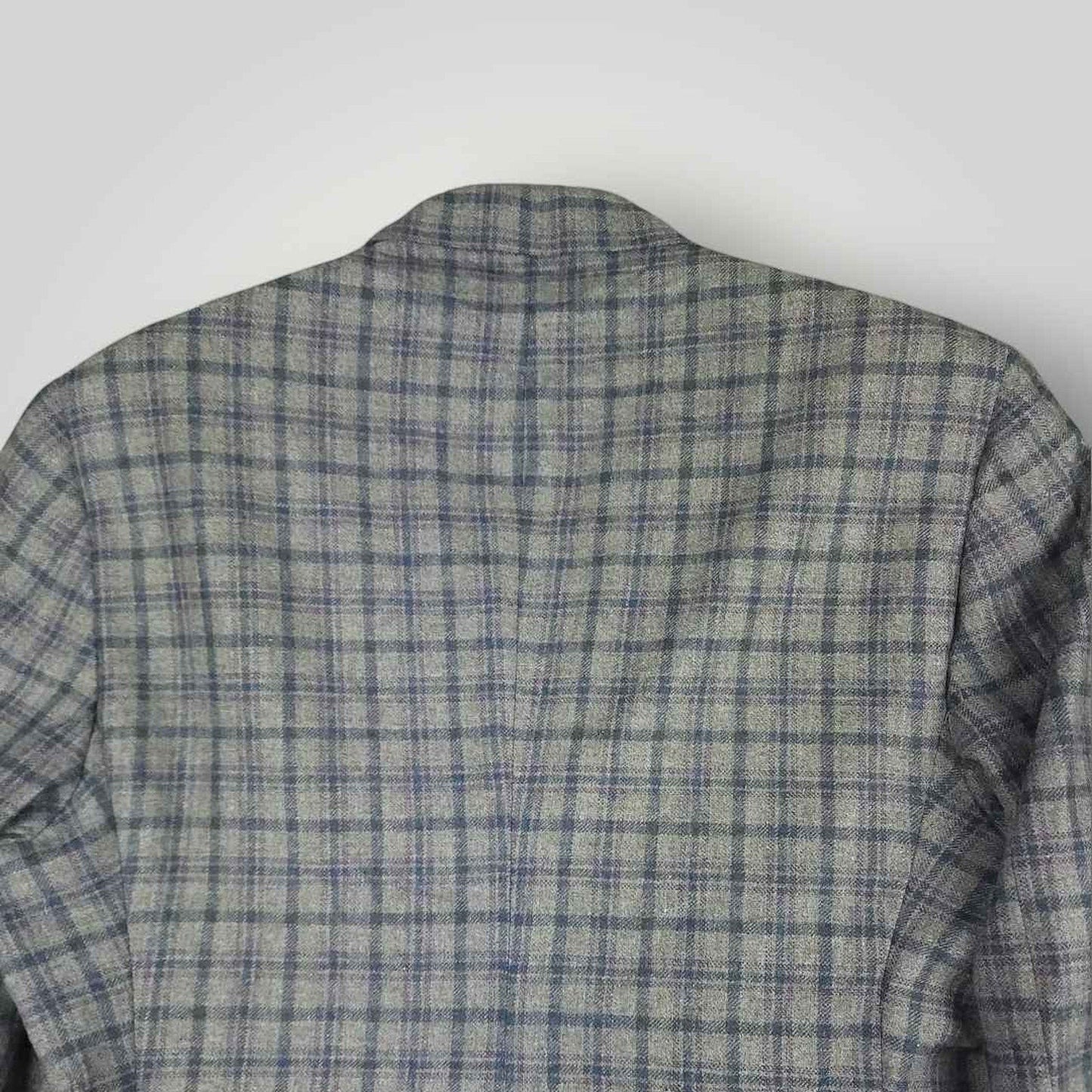 Upper back detail of Tom James Innocenti plaid sack jacket showing pattern alignment and tailoring.