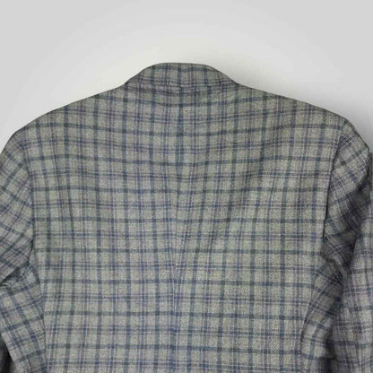 Upper back detail of Tom James Innocenti plaid sack jacket showing pattern alignment and tailoring.