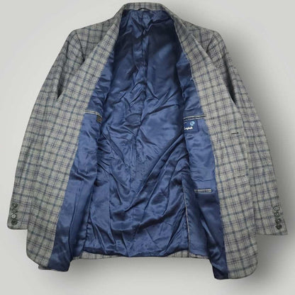 Interior view of Tom James Innocenti sport coat showing blue satin lining and full canvas construction details.
