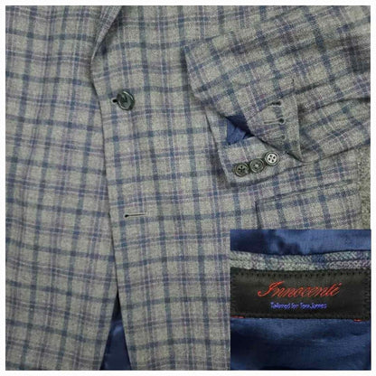 Tom James Innocenti Italian wool plaid sport coat fabric detail showing blue-gray tartan pattern and Innocenti label.