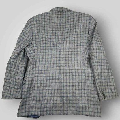 Rear view of Tom James Innocenti Italian wool plaid sport coat showing classic tailored construction.