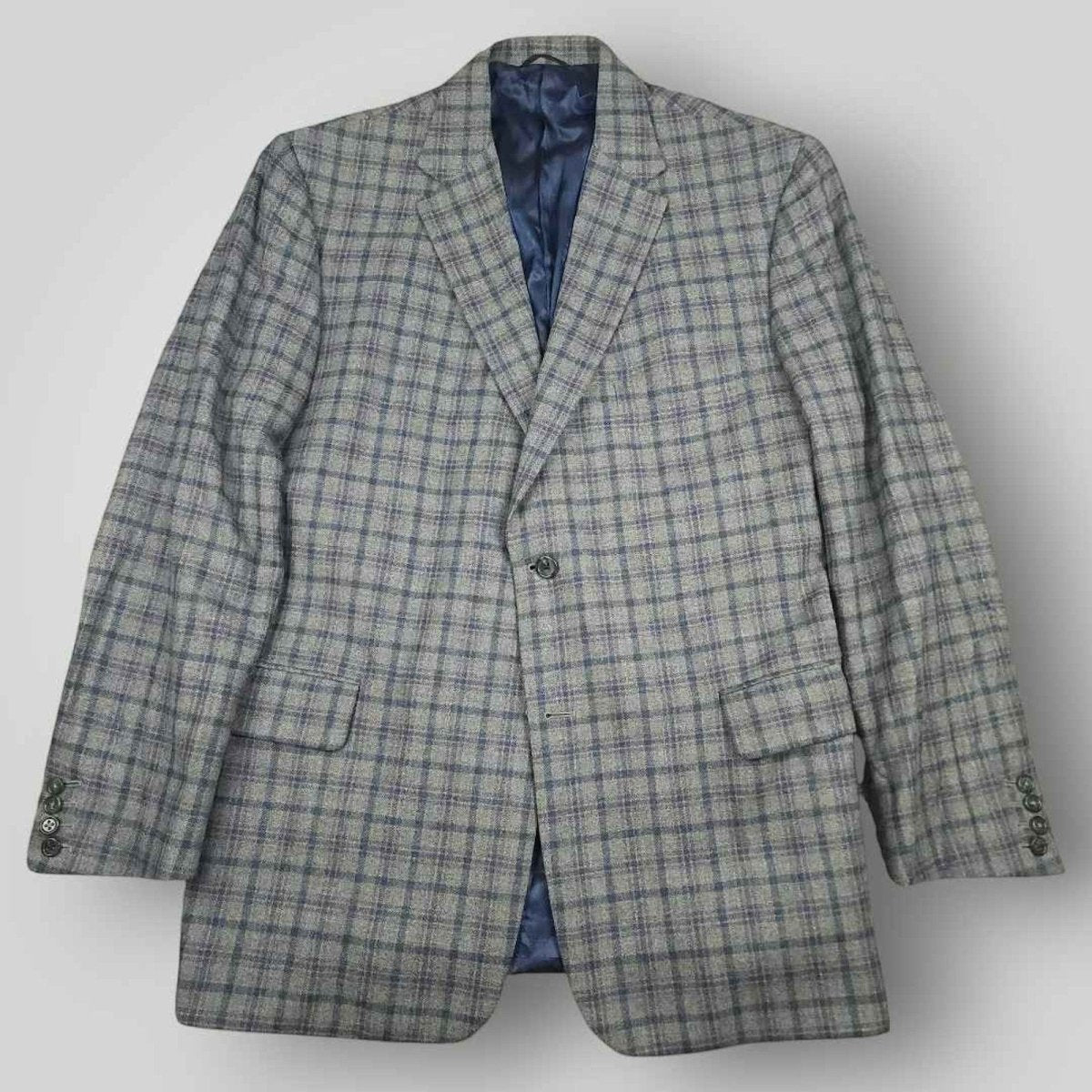 Front view of Tom James Innocenti plaid wool sport coat featuring notched lapels and tailored silhouette.