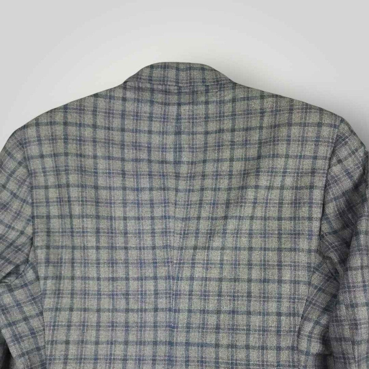 Upper back detail of Tom James Innocenti plaid sack jacket showing pattern alignment and tailoring.