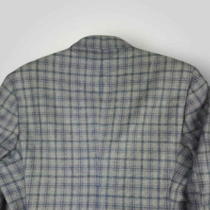Upper back detail of Tom James Innocenti plaid sack jacket showing pattern alignment and tailoring.