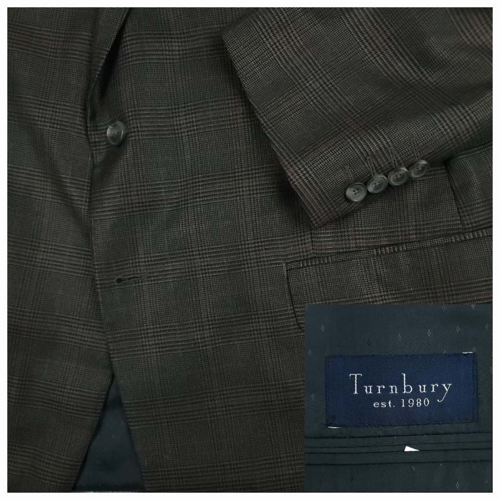 Turnbury wool silk glen plaid sport coat fabric detail showing charcoal gray Prince of Wales check pattern and Turnbury label.