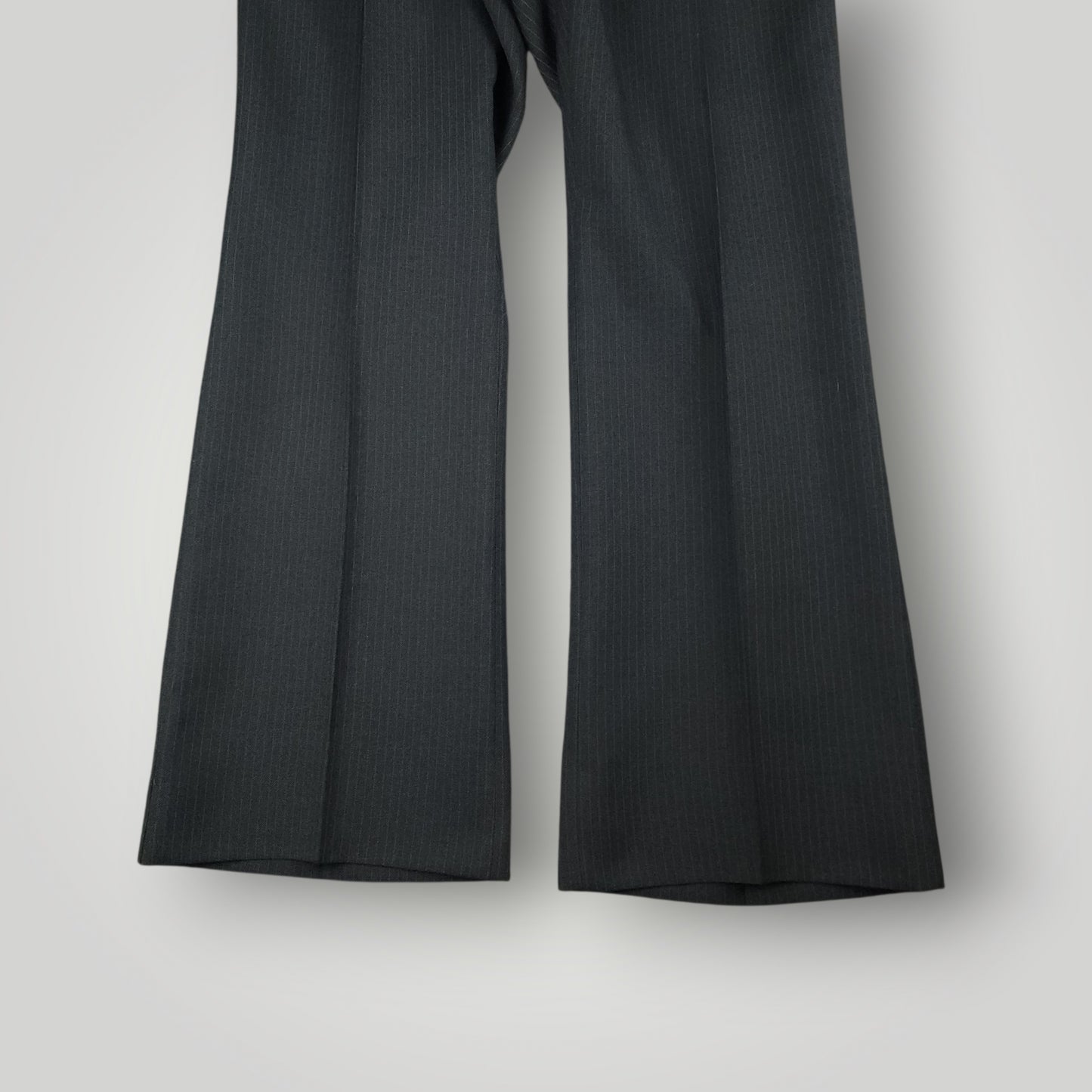 Flared, bell bottom leg opening detail on vintage wool suit trousers