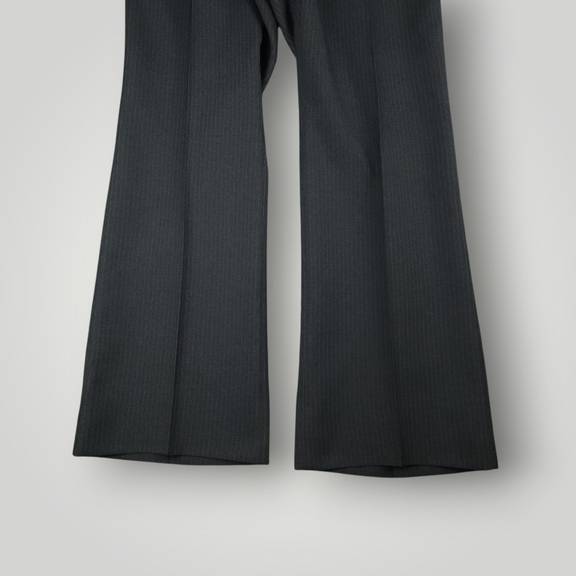 Flared, bell bottom leg opening detail on vintage wool suit trousers