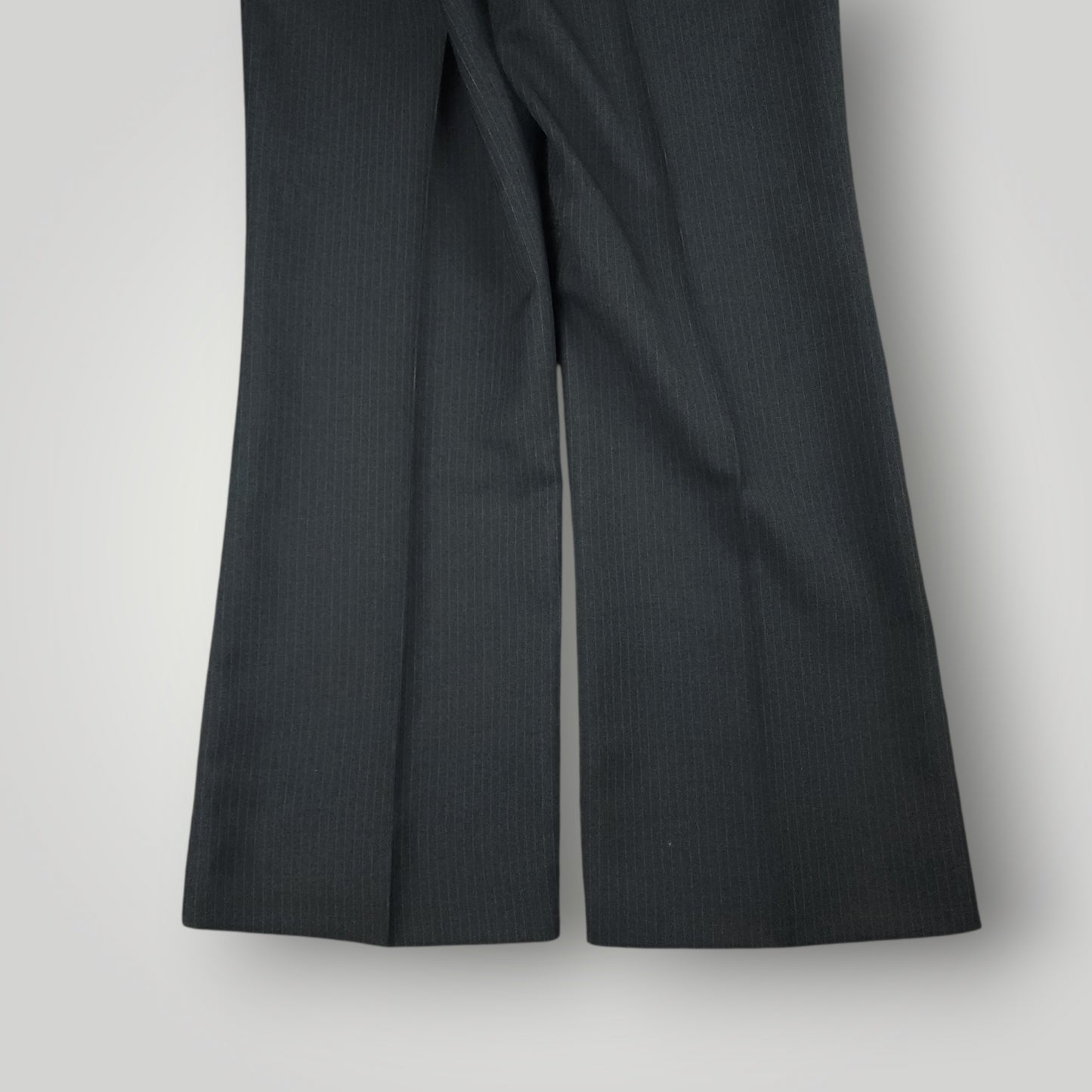 Side crease and drape detail of vintage pinstripe trousers