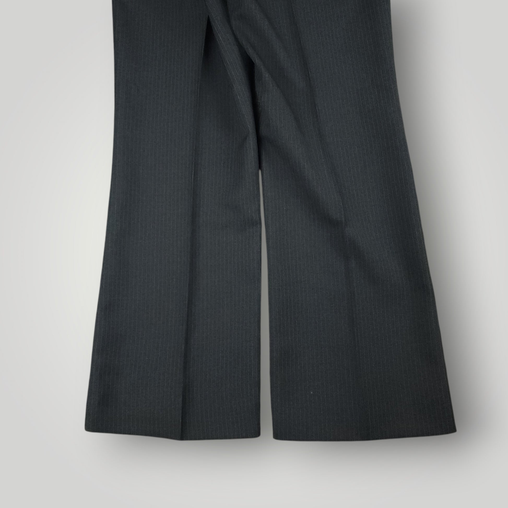 Side crease and drape detail of vintage pinstripe trousers