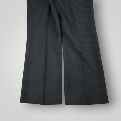 Side crease and drape detail of vintage pinstripe trousers
