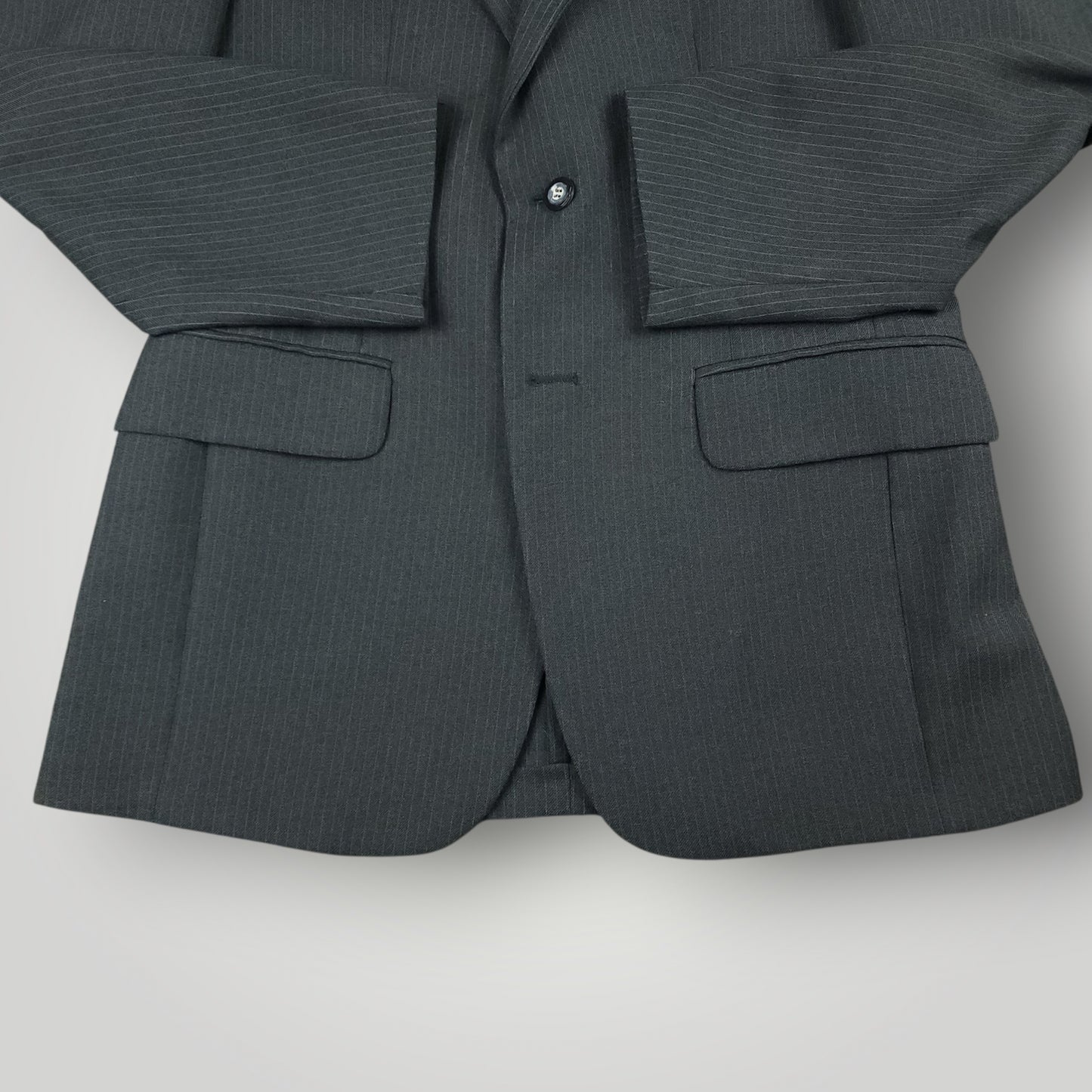 Flap pocket detail on vintage steel blue pinstripe suit jacket