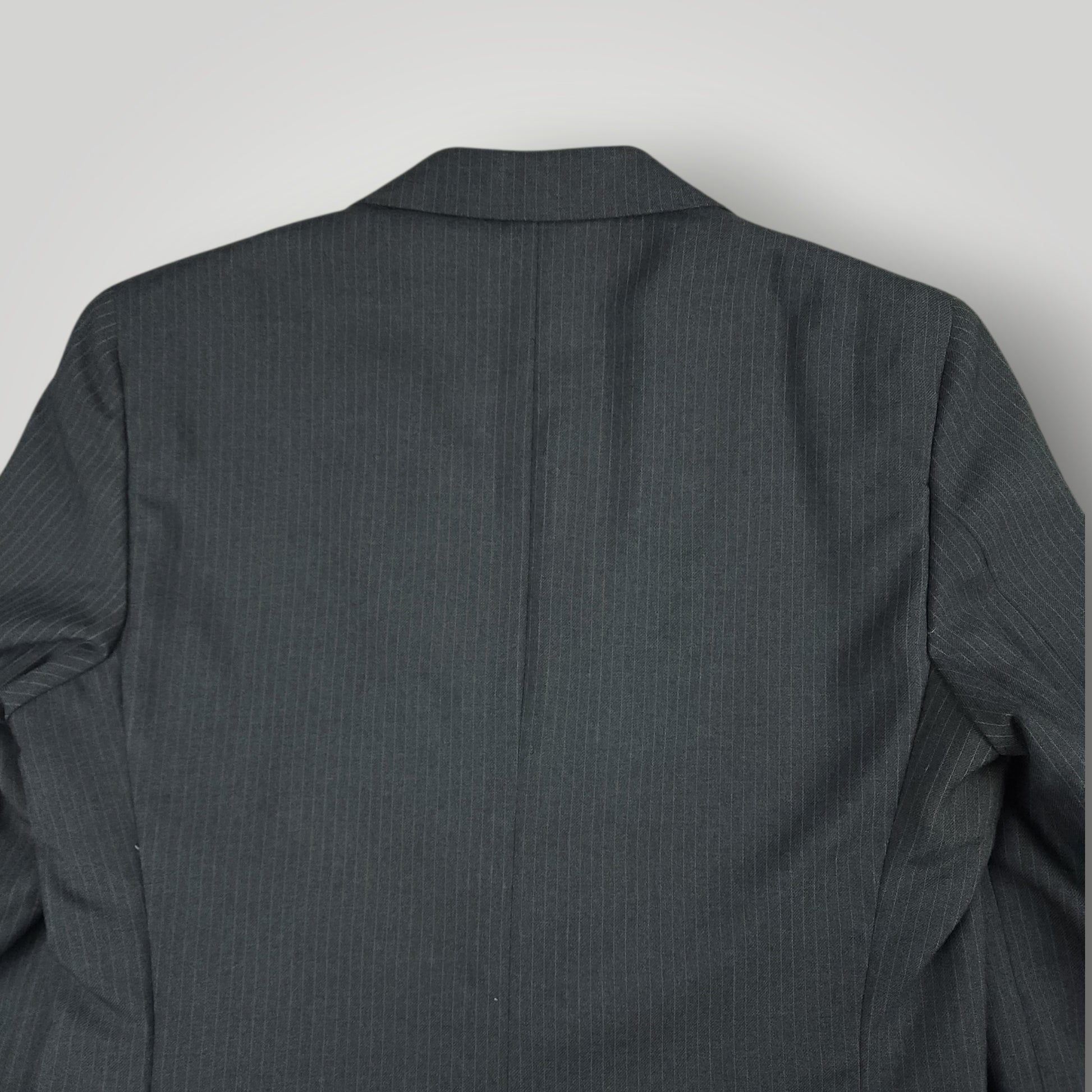 Vintage J. Riggings steel blue suit jacket angled rear view
