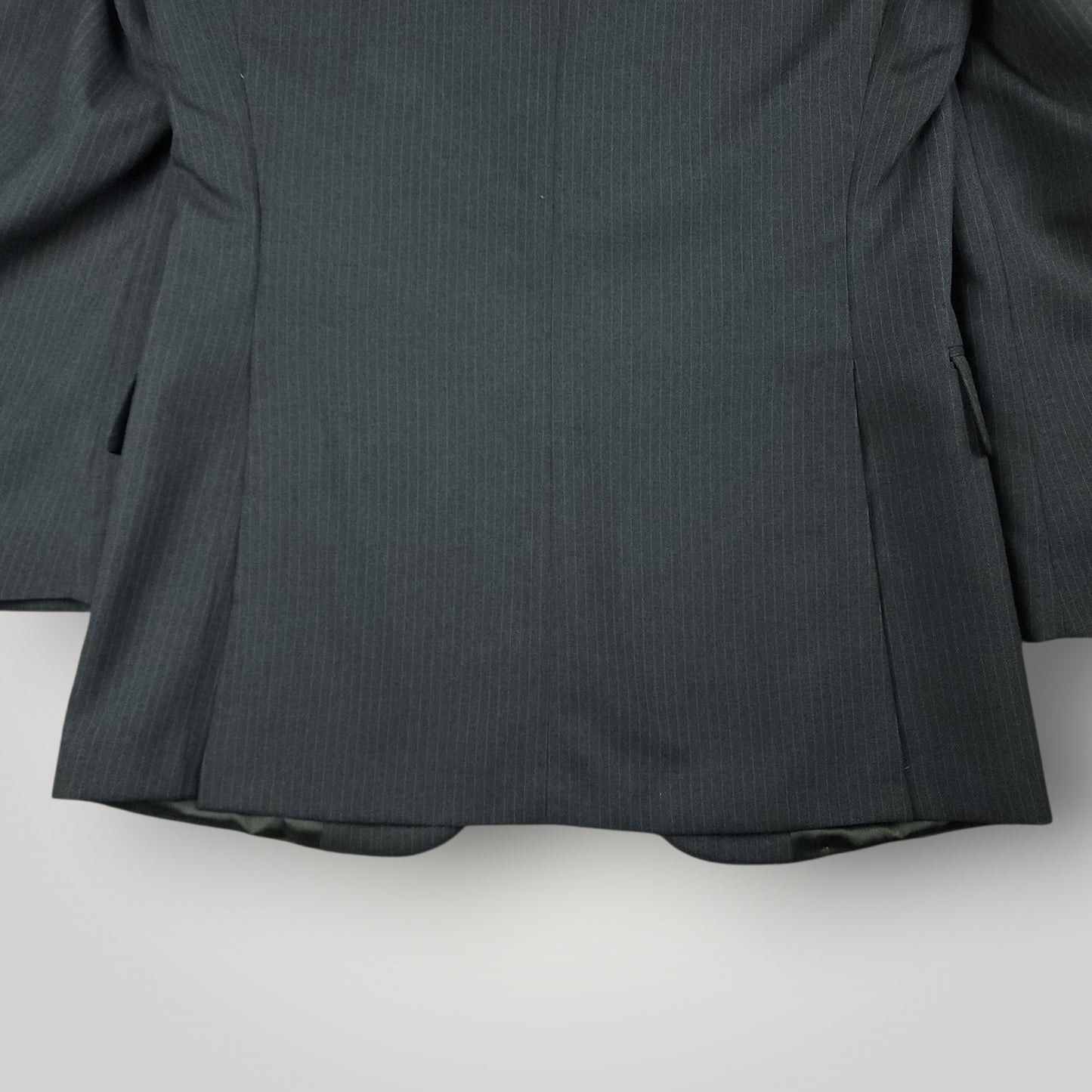 Rear vent detail on vintage tropical wool suit jacket