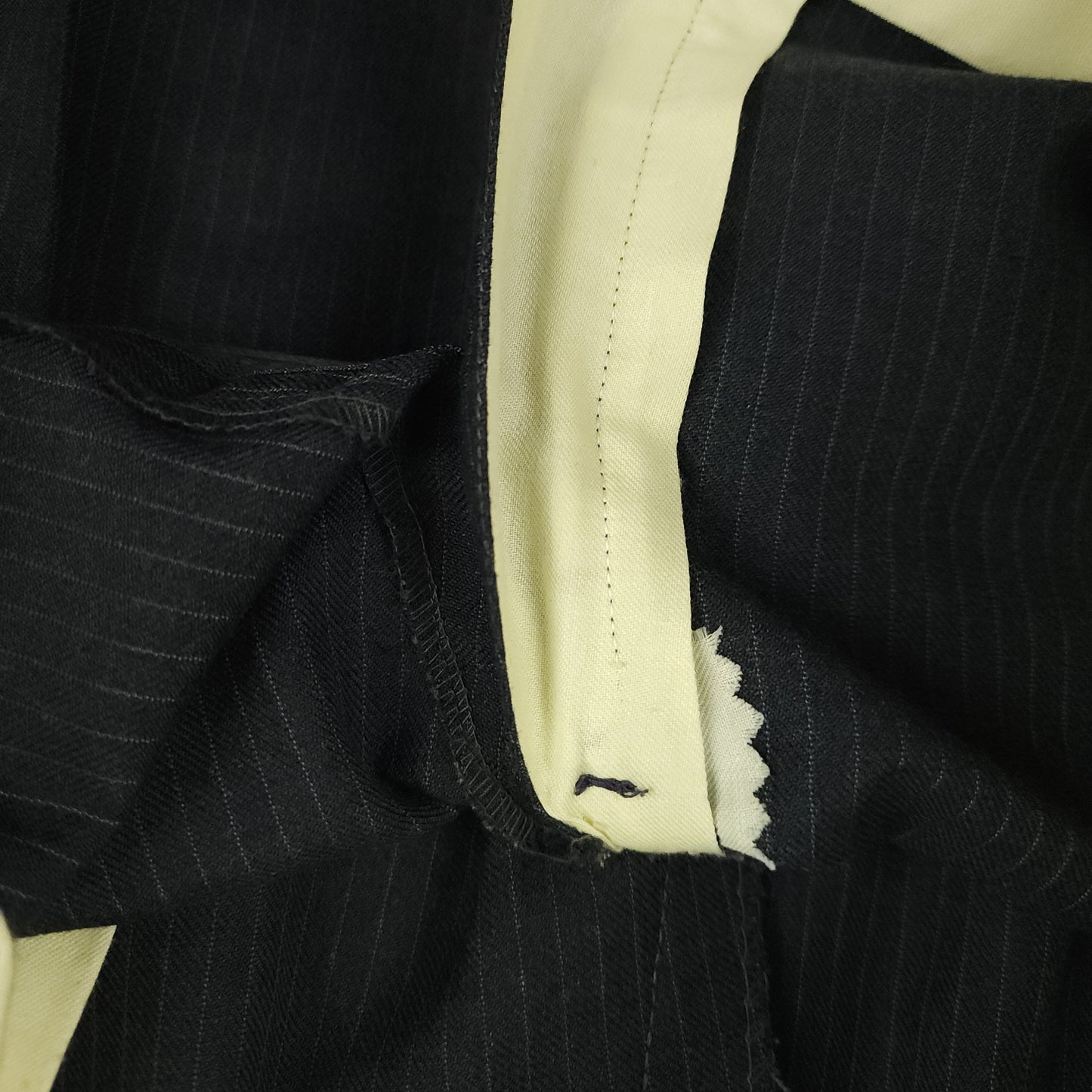Interior zipper and waistband construction detail on vintage trousers