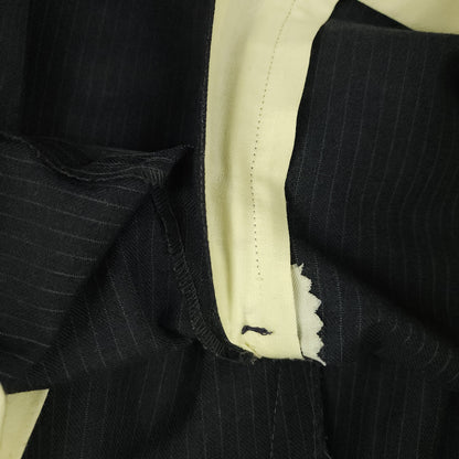 Interior zipper and waistband construction detail on vintage trousers