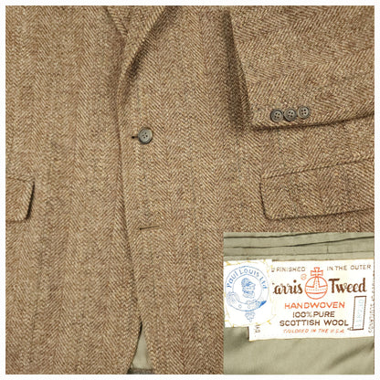 Close up of Harris Tweed wool fabric showing brown herringbone texture and pattern