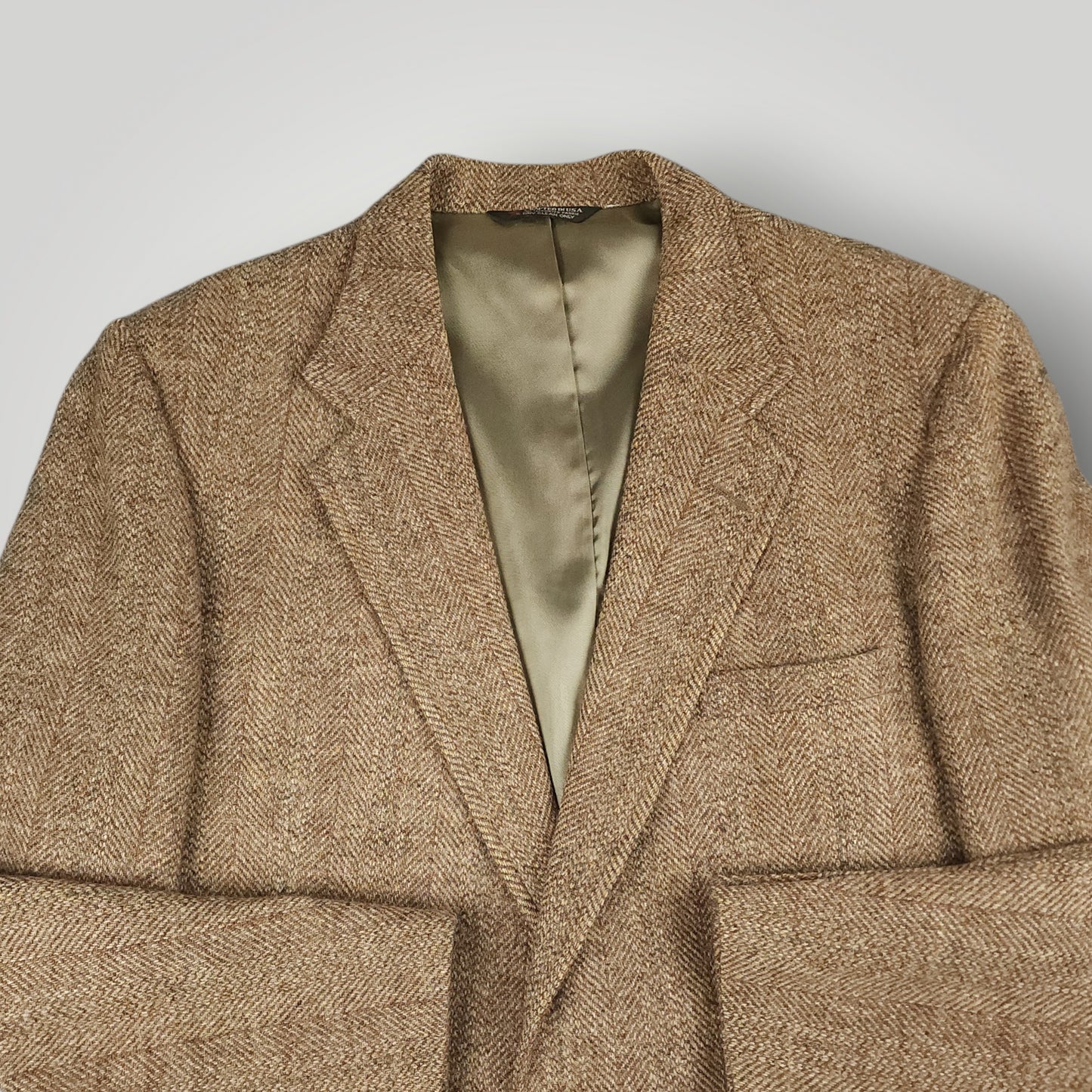 Front angle view of brown herringbone Harris Tweed sport coat
