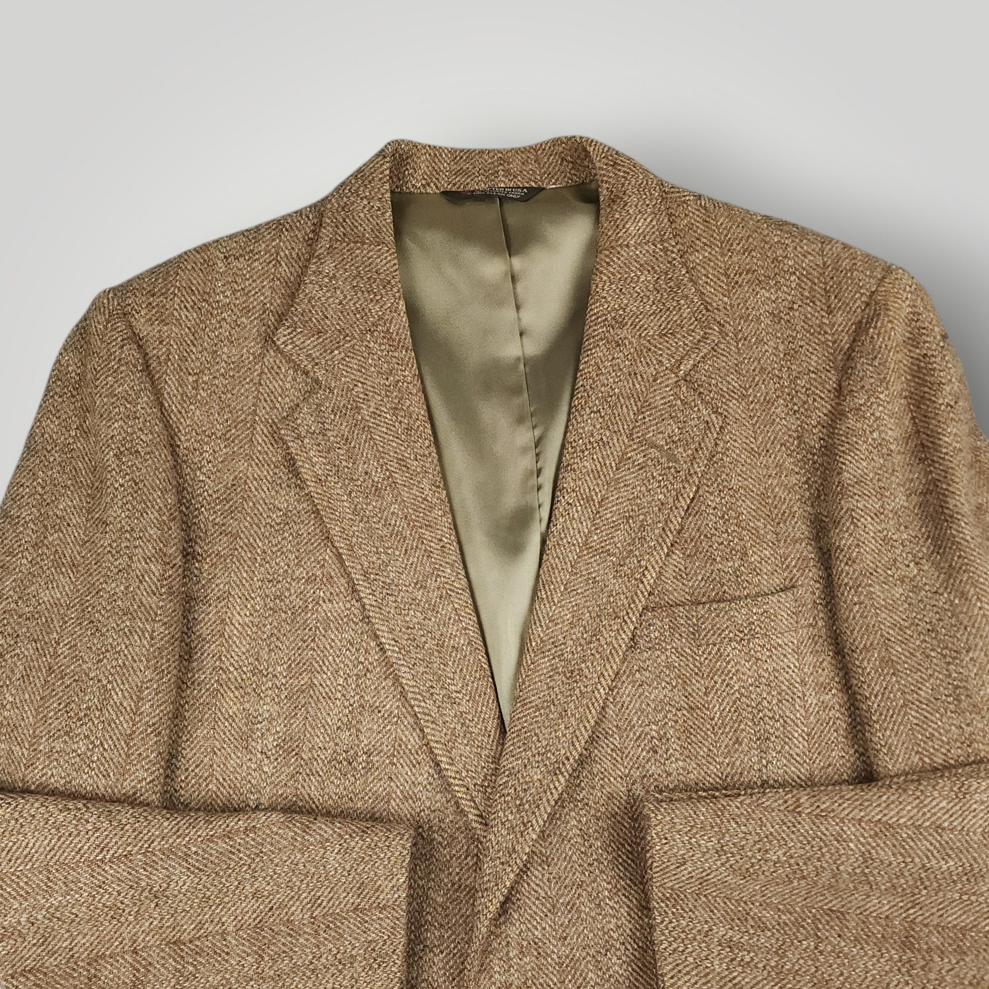 Front angle view of brown herringbone Harris Tweed sport coat