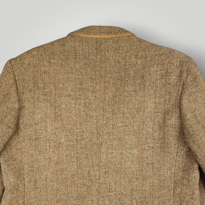 Rear shoulder detail showing texture of brown Harris Tweed wool fabric