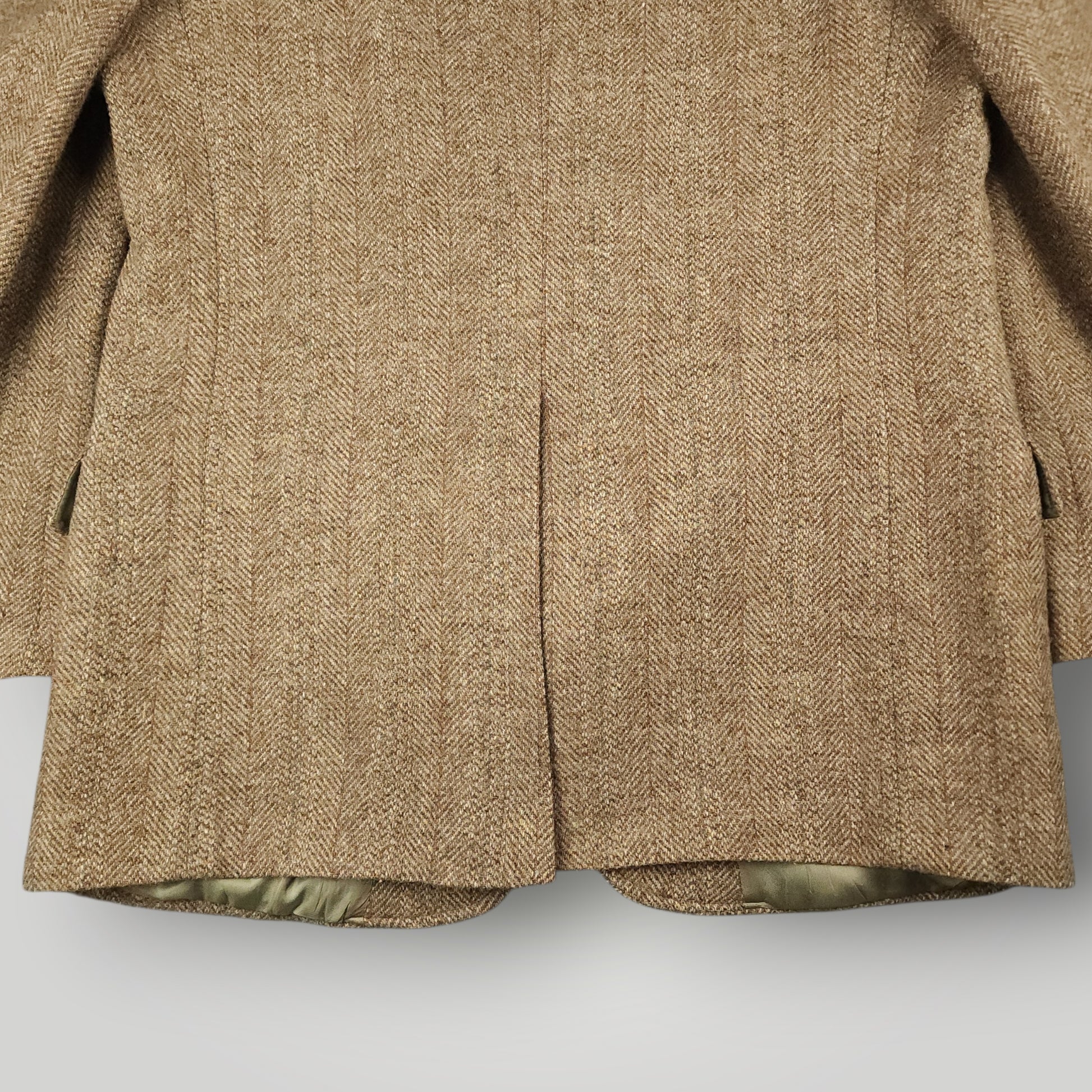 Bottom rear vent detail on vintage Harris Tweed sport coat